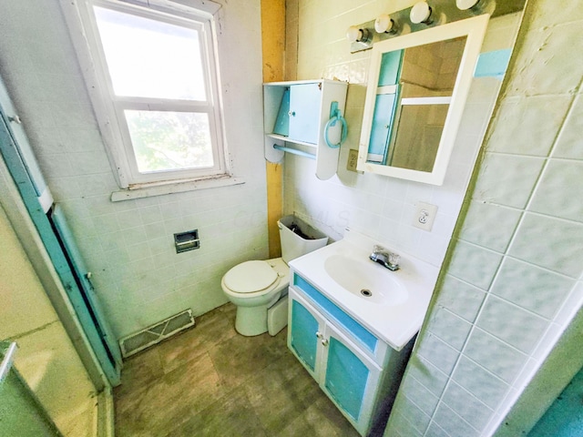 16251 State Route 678, Rockbridge, OH 43149 - bathroom featuring tile walls, vanity, a shower stall, and toilet