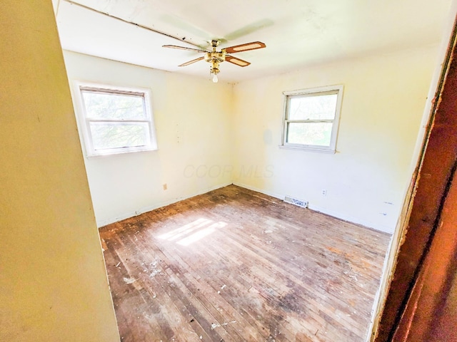 16251 State Route 678, Rockbridge, OH 43149 - spare room with hardwood / wood-style floors, a ceiling fan, and baseboards