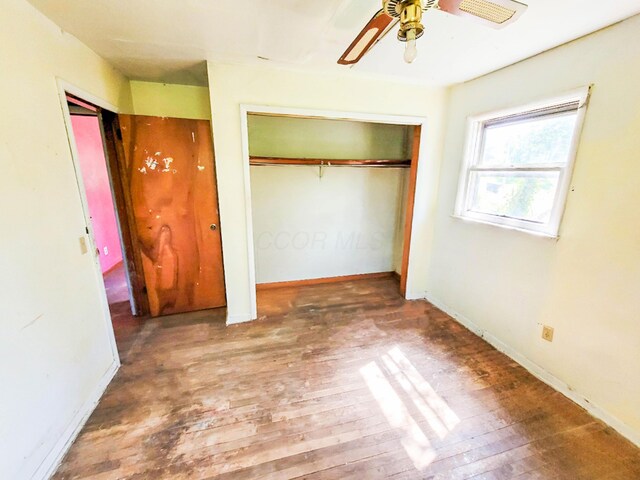 16251 State Route 678, Rockbridge, OH 43149 - unfurnished bedroom with hardwood / wood-style floors, baseboards, and a ceiling fan