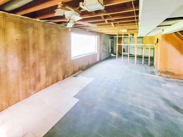 16251 State Route 678, Rockbridge, OH 43149 - basement with wood walls and a ceiling fan