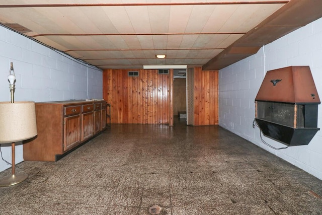 1266 Hanley Rd W, Mansfield, OH 44903 - bar featuring concrete block wall, dark flooring, and wood walls