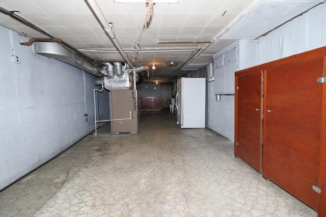 1266 Hanley Rd W, Mansfield, OH 44903 - below grade area with tile patterned floors, concrete block wall, and heating unit