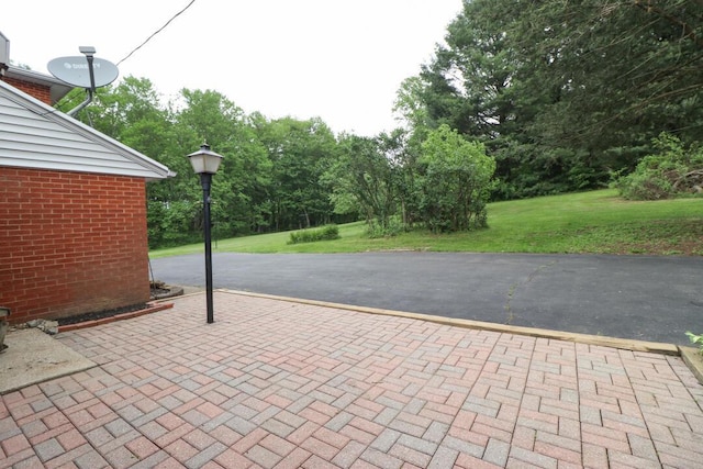 1266 Hanley Rd W, Mansfield, OH 44903 - view of patio / terrace with view of wooded area