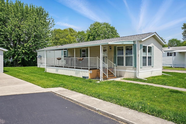 3200 Smeltzer Rd Unit 90, Marion, OH 43302 - manufactured / mobile home featuring covered porch and a front lawn