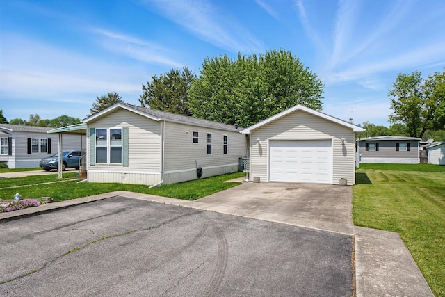 3200 Smeltzer Rd Unit 90, Marion, OH 43302 - manufactured / mobile home featuring a detached garage, an outdoor structure, a front lawn, and driveway