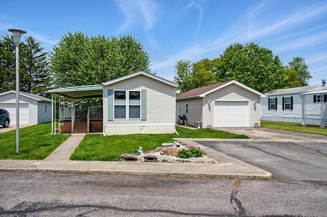 3200 Smeltzer Rd Unit 90, Marion, OH 43302 - manufactured / mobile home featuring a garage, an outdoor structure, and a front yard