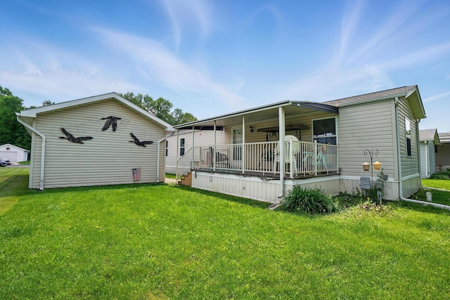 3200 Smeltzer Rd Unit 90, Marion, OH 43302 - rear view of property with a lawn and a porch