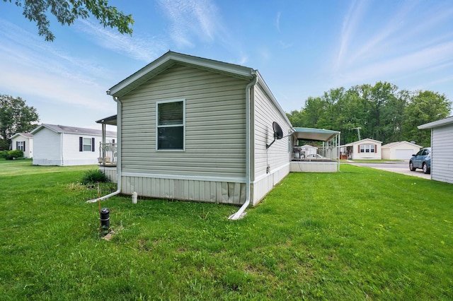3200 Smeltzer Rd Unit 90, Marion, OH 43302 - view of home's exterior with a lawn