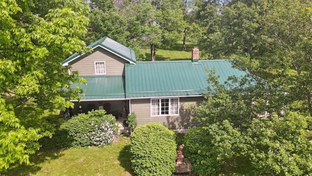 5870 Brook Rd NW, Baltimore, OH 43105 - view of property exterior featuring a chimney, a lawn, and view of scattered trees