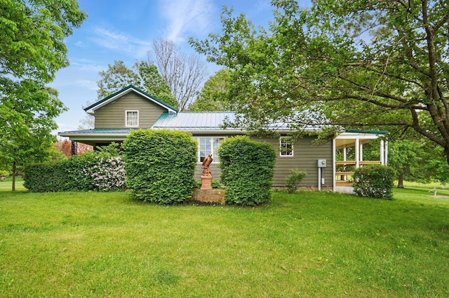 5870 Brook Rd NW, Baltimore, OH 43105 - rear view of house with a lawn and metal roof