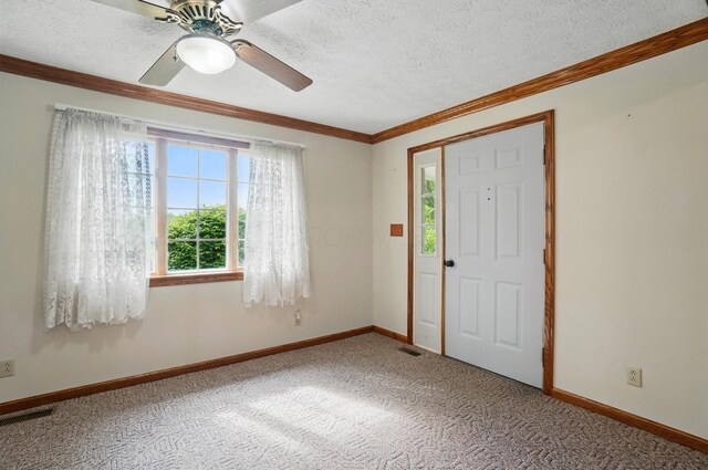 5870 Brook Rd NW, Baltimore, OH 43105 - entrance foyer with ornamental molding, a textured ceiling, baseboards, carpet flooring, and ceiling fan