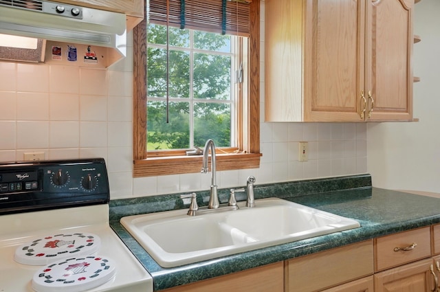 5870 Brook Rd NW, Baltimore, OH 43105 - kitchen with range, a sink, range hood, dark countertops, and light brown cabinets