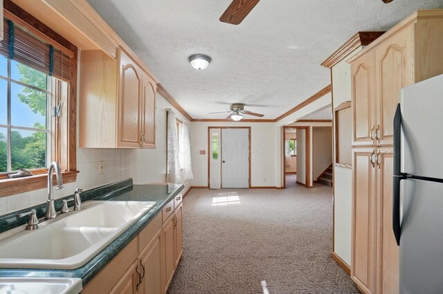 5870 Brook Rd NW, Baltimore, OH 43105 - kitchen featuring freestanding refrigerator, ceiling fan, a sink, light brown cabinets, and carpet floors