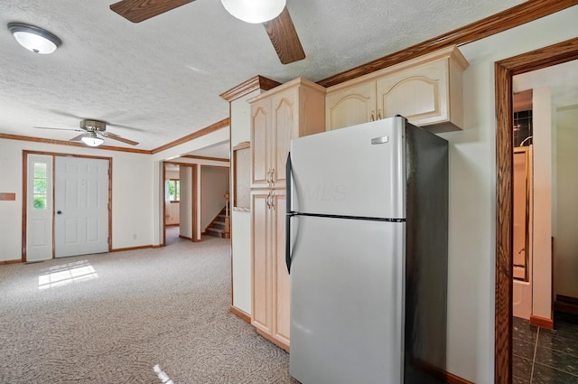 5870 Brook Rd NW, Baltimore, OH 43105 - kitchen featuring freestanding refrigerator, a ceiling fan, crown molding, a textured ceiling, and baseboards