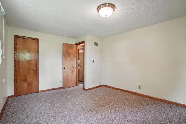 5870 Brook Rd NW, Baltimore, OH 43105 - unfurnished bedroom featuring light colored carpet, baseboards, and a textured ceiling