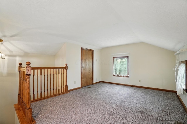 5870 Brook Rd NW, Baltimore, OH 43105 - additional living space with vaulted ceiling, carpet, and baseboards