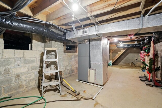5870 Brook Rd NW, Baltimore, OH 43105 - unfinished basement with stairs and heating unit