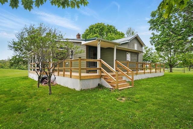 5870 Brook Rd NW, Baltimore, OH 43105 - rear view of property featuring a lawn, a chimney, and a deck