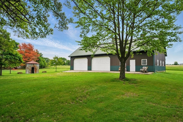5870 Brook Rd NW, Baltimore, OH 43105 - view of green lawn featuring an outdoor structure and a detached garage