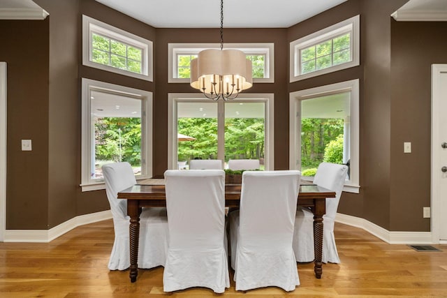 712 Riverbend Ave, Powell, OH 43065 - dining space featuring a chandelier, light wood-style floors, baseboards, and a high ceiling