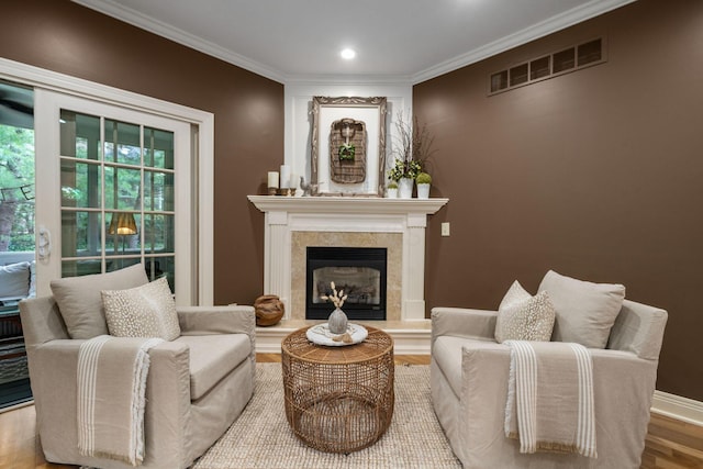 712 Riverbend Ave, Powell, OH 43065 - sitting room with wood finished floors, ornamental molding, a fireplace, recessed lighting, and baseboards