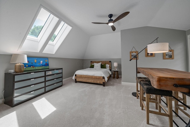 712 Riverbend Ave, Powell, OH 43065 - bedroom with vaulted ceiling, a skylight, carpet floors, baseboards, and ceiling fan