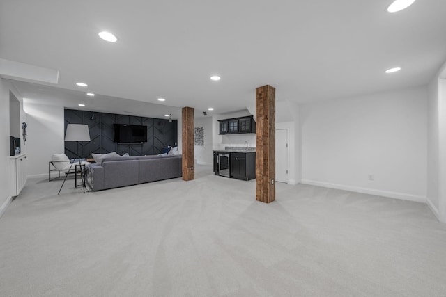712 Riverbend Ave, Powell, OH 43065 - living room featuring wet bar, light colored carpet, baseboards, and recessed lighting
