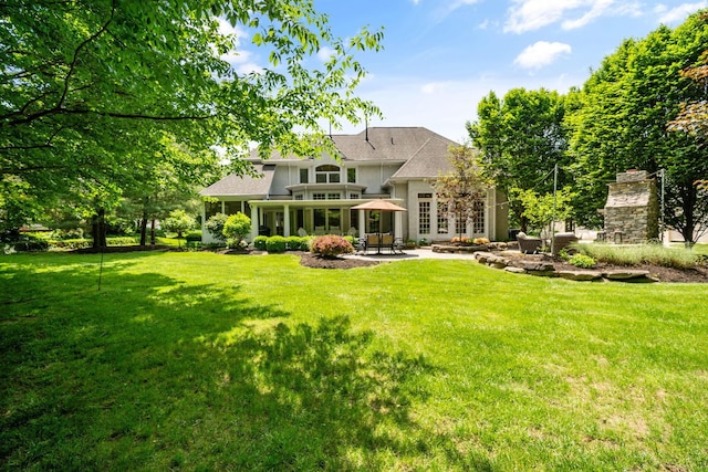 712 Riverbend Ave, Powell, OH 43065 - rear view of property with a patio, a yard, and a shingled roof
