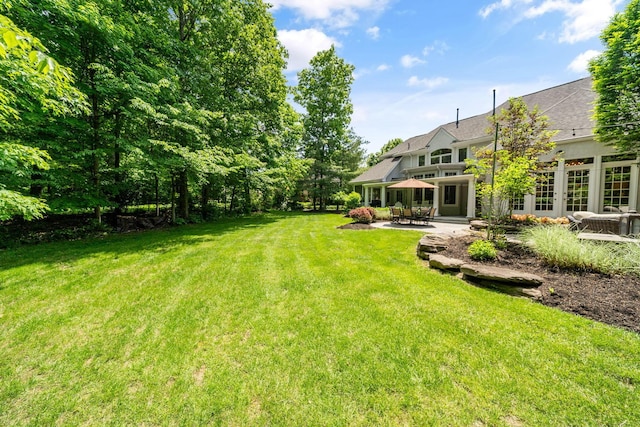 712 Riverbend Ave, Powell, OH 43065 - view of grassy yard featuring a patio