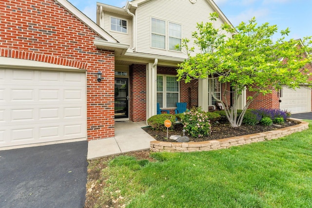 308 Postage Cir, Pickerington, OH 43147 - view of front of home with brick siding, driveway, and a front lawn