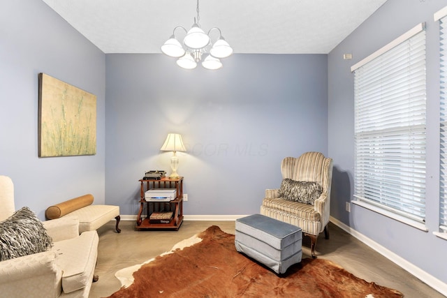 308 Postage Cir, Pickerington, OH 43147 - living area featuring a chandelier, baseboards, and plenty of natural light