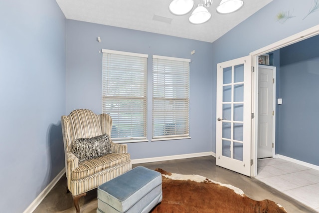 308 Postage Cir, Pickerington, OH 43147 - sitting room with a chandelier, baseboards, and concrete flooring
