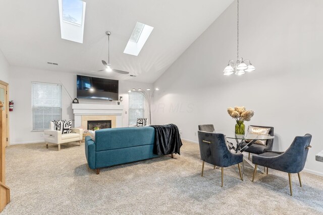 308 Postage Cir, Pickerington, OH 43147 - living area with carpet floors, a skylight, a lit fireplace, baseboards, and high vaulted ceiling