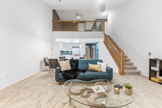 308 Postage Cir, Pickerington, OH 43147 - living room with carpet floors, a towering ceiling, stairs, and baseboards