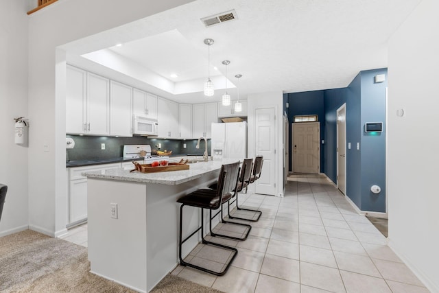 308 Postage Cir, Pickerington, OH 43147 - kitchen with white appliances, white cabinets, light tile patterned floors, a sink, and recessed lighting