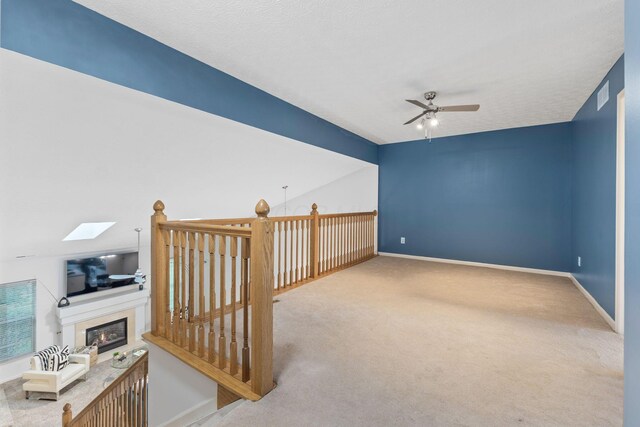 308 Postage Cir, Pickerington, OH 43147 - bonus room featuring a ceiling fan, carpet flooring, and a glass covered fireplace