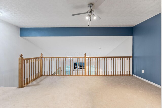 308 Postage Cir, Pickerington, OH 43147 - carpeted empty room with ceiling fan, a textured ceiling, and baseboards