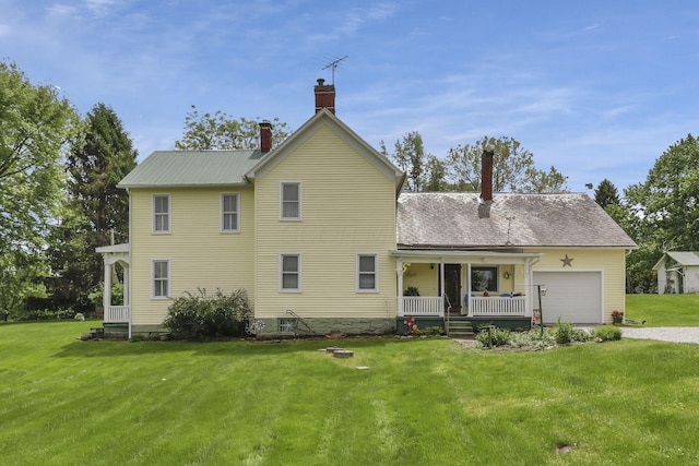 1625 Stringtown Rd NE, Lancaster, OH 43130 - back of house featuring a chimney, a garage, and a yard