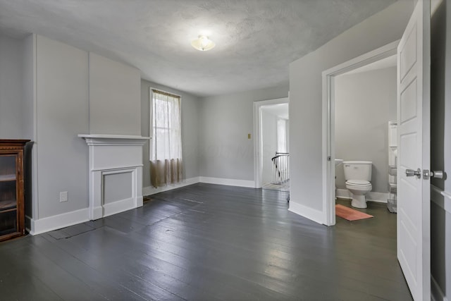 1625 Stringtown Rd NE, Lancaster, OH 43130 - unfurnished living room with baseboards and dark wood finished floors