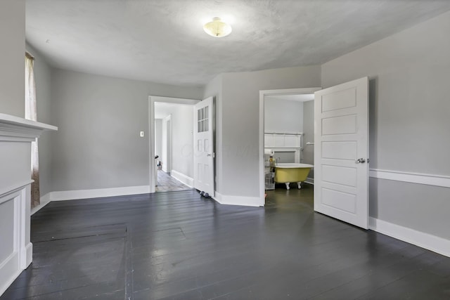 1625 Stringtown Rd NE, Lancaster, OH 43130 - unfurnished living room with baseboards and dark wood-style flooring