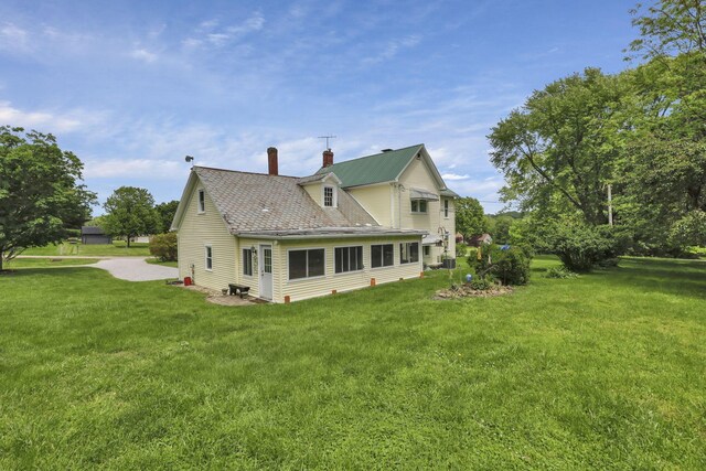 1625 Stringtown Rd NE, Lancaster, OH 43130 - rear view of property featuring a chimney and a yard