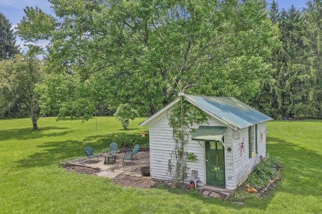 1625 Stringtown Rd NE, Lancaster, OH 43130 - view of outdoor structure featuring an outdoor fire pit and an outbuilding