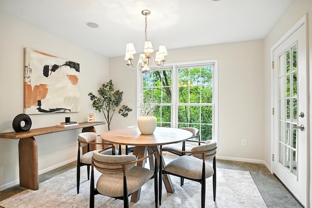 1223 Sanctuary Pl, Columbus, OH 43230 - dining area featuring healthy amount of natural light, a chandelier, and light colored carpet