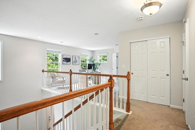 1223 Sanctuary Pl, Columbus, OH 43230 - hallway featuring light colored carpet, healthy amount of natural light, an upstairs landing, and recessed lighting