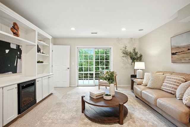 1223 Sanctuary Pl, Columbus, OH 43230 - living room featuring beverage cooler, light colored carpet, and recessed lighting
