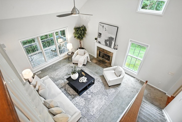 1223 Sanctuary Pl, Columbus, OH 43230 - living area featuring high vaulted ceiling, plenty of natural light, a fireplace, a ceiling fan, and carpet floors