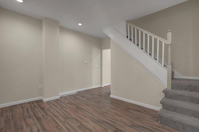 564-564 Kelton Ave, Columbus, OH 43205 - unfurnished living room featuring dark wood-style flooring, recessed lighting, stairs, and baseboards
