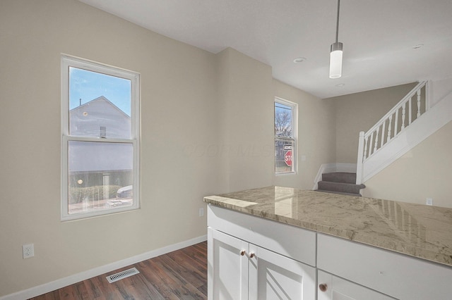 564-564 Kelton Ave, Columbus, OH 43205 - kitchen featuring dark wood-style floors, plenty of natural light, baseboards, and white cabinetry