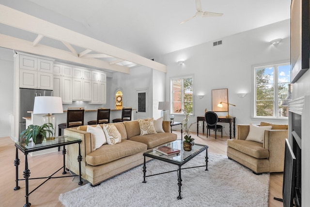 382 E Town St, Columbus, OH 43215 - living area with a fireplace, light wood-style flooring, a towering ceiling, and beamed ceiling