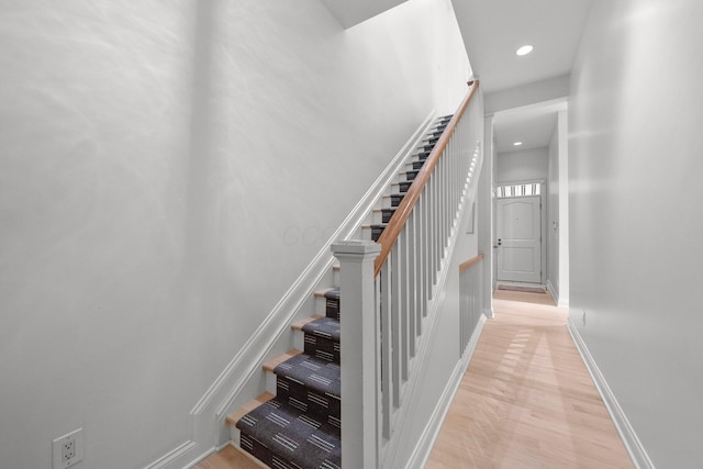 382 E Town St, Columbus, OH 43215 - staircase featuring wood finished floors, recessed lighting, and baseboards